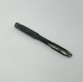 A single dark metal threaded tool bit, likely a tap or reamer, placed diagonally on a textured white fabric background.